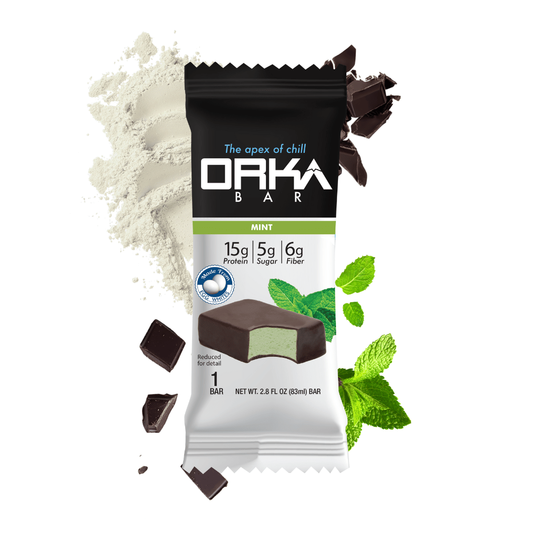 Orka Bar mint flavor packaging with chocolate pieces and mint leaves on a white background