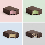 Four different chocolate-covered ice cream protein bars on a grid with pastel backgrounds.