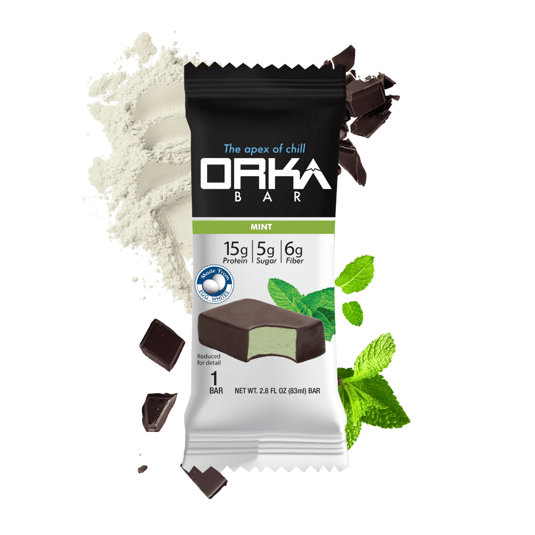 Orka Bar mint flavor packaging with chocolate pieces and mint leaves on a green background