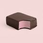 Raspberry protein ice cream bar on a light pink background